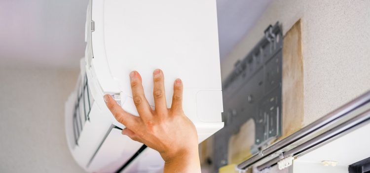 HVAC installer replacing a mini-split