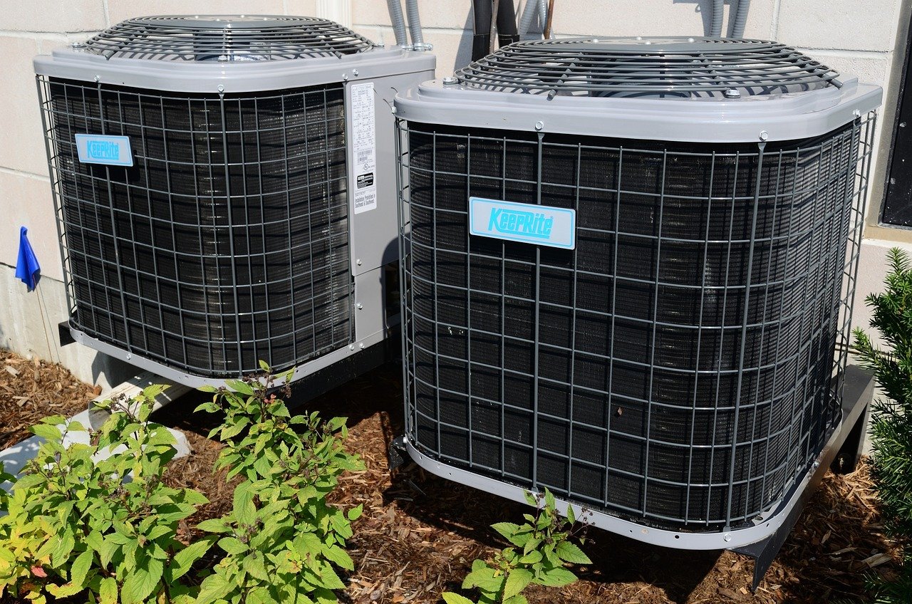 Two AC condenser units side by side